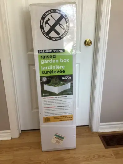 I'm selling a brand new NuVue Raised Garden Bed in white, perfect for starting your own little garde...