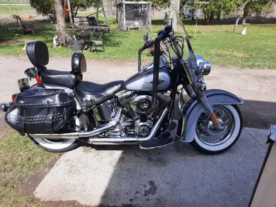 This Harley-Davidson Heritage Softail is a classic cruiser featuring iconic whitewall tires, leather...