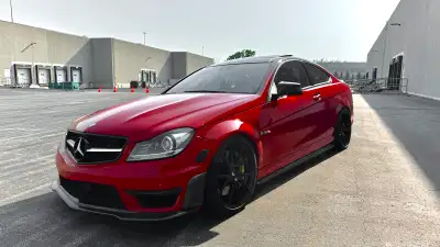 2012 Mercedes-Benz C63 AMG Coupe finished in Mars Red with black leather interior. This is the W204...