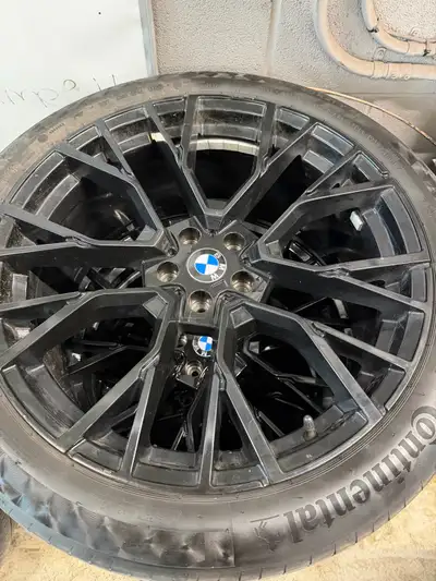 275/40/21-315/35/21 Continental all season tires with black aftermarket rims for a G05 bmw x5. Tires...