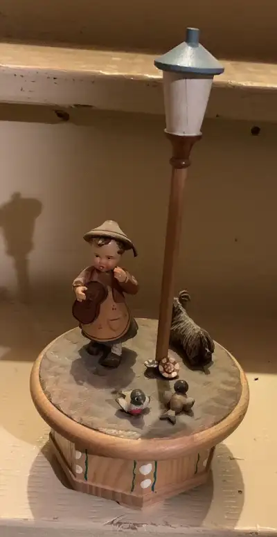 This is for a vintage Thorens Movement Switzerland Wood “GIGI” Music Box. It has a lamp post, a girl...