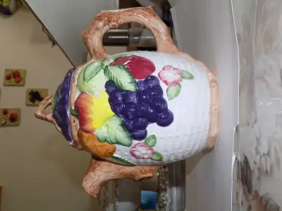 this is a part of a kitchen set of decorative jars and a gravy jar and a serving platar it has been...
