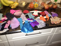 Collection of Barbie clothes for sale