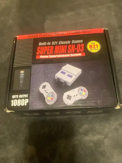 Relive your childhood with this Super Mini SN-03 HD TV Game console, featuring 821 classic games bui...