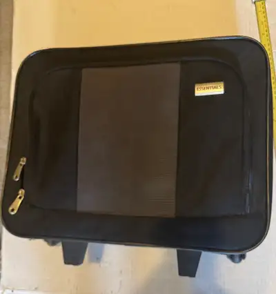 This Essentials rolling carry-on is perfect for short trips or as an additional luggage option; it's...