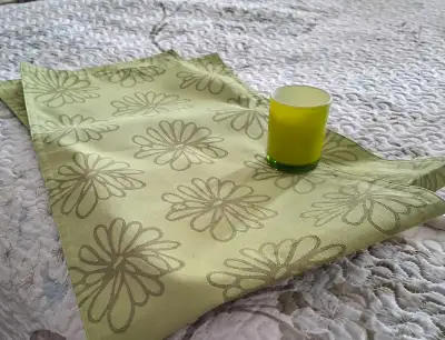 Lime green decor items: lamp with clear glass base & green shade; 2 runners (13" x 47"); small candl...