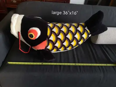 This is a large Koi fish plush, measuring 36"x16". It's a unique and cuddly piece that's sure to mak...