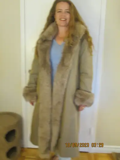 Beautiful fur trimmed coat., View more