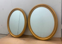 A pair of large vintage oval shape wall mirrors, new gold paint