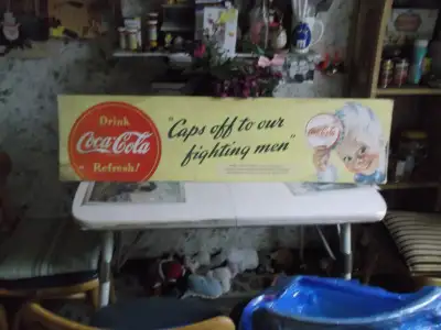 W.W. II, 1940s, LARGE COCA-COLA ADVERTISING SIGN, MEASURES APPROX. 11 X 42 INCHES. LOCAL BUS AD STIL...