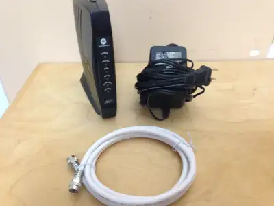 Motorola SB5100 modem with power pack and coax cable, View more