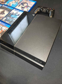 PS4 with games and controller