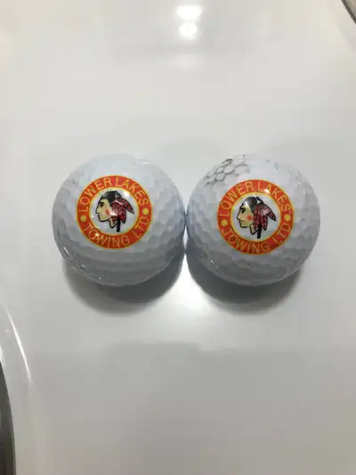 Two Lower Lakes Towing Ltd collectible golf balls . Lower Lakes Towing Ltd is a Great Lakes freighte...