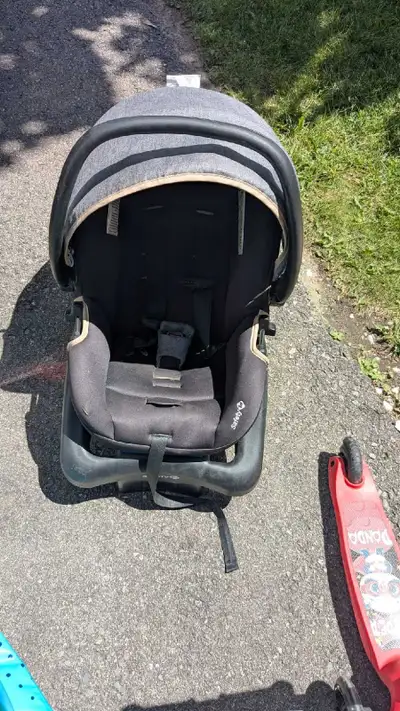 Child car seat in good working condition. Clean overall, with some visible dirt, stains, and normal...