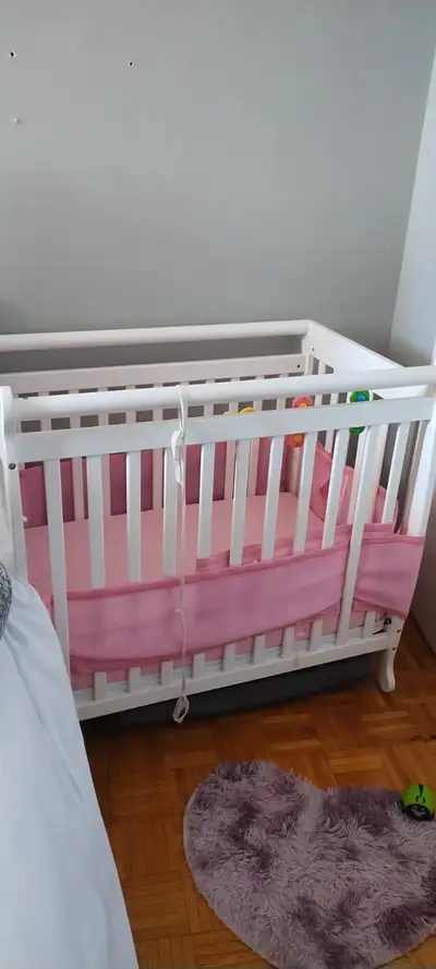 Adorable Mini Crib with mattress in great condition and adjustable height from infant to toddler. Di...