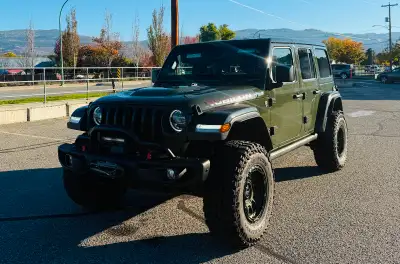 This 2021 Jeep Wrangler Rubicon has everything. -Factory suspension lift -Brand New 35” Mickey Thomp...