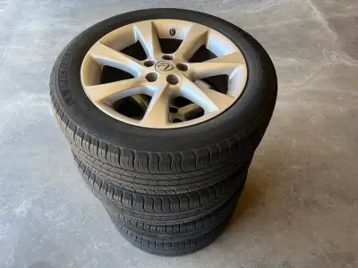 A set four season Michelin tires and Lexus Rims with tire pressure sensor from RX 350. 70% tread lef...