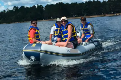 Boat (Zodiac), 15 Hp motor (Honda), Life jackets, Gas can, gas line, manual, Wheels for boat, Cart f...
