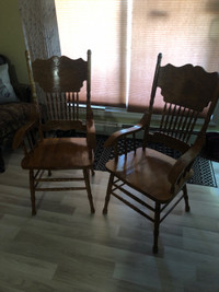 2 solid wood arm dining room chairs 