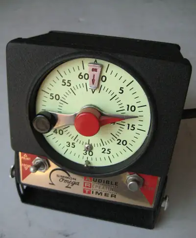 Timers,..Easels.. enlarger lenses, lens mounting cones for Omega enlargers. SS developing tanks and...