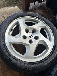 Honda Prelude OEM wheels with slightly used winter tires.