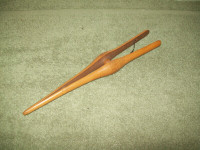 Set of three antique wooden items glove stretcher paddle spoon