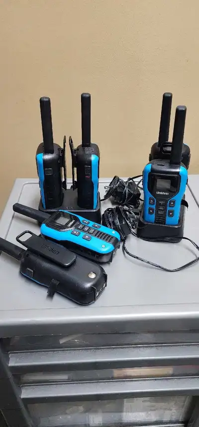6 Uniden Two-Way Radios Charging bases and belt clips included. $60 Please see other ads!
