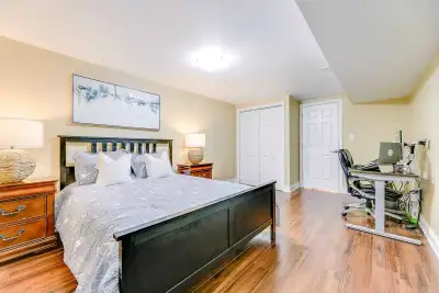 Welcome to this exceptionally spacious and beautifully maintained basement apartment in a quiet, fam...