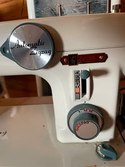 Imperial zigzag sewing machine. 40+ years. Yes it works. Comes with zig zag disks, manual and access...