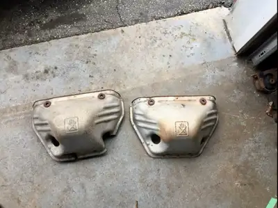 These are a pair of used MR2 Spyder exhaust manifold heat shields, perfect for protecting your engin...