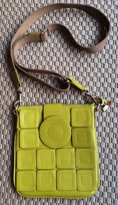 Olive colour, nice pattern, flap and zipper closure on top , 1 pocket on the back with zipper. Size:...