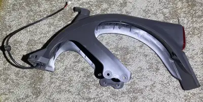 This is a New Ninebot Max G2 scooter rear fender with tail light, designed to protect your ride and...