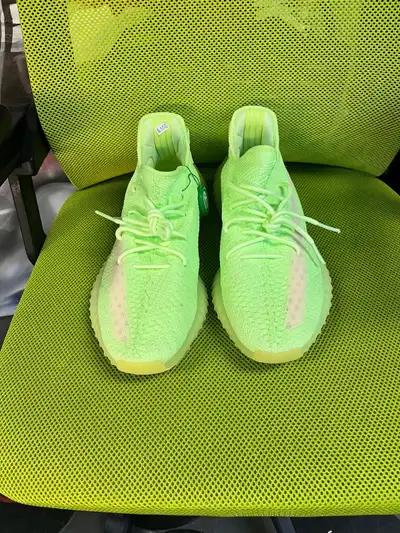 This is for a pair of Adidas Yeezy Boost 350 V2 Glow in the dark shoes. They are size 11.5 and look...