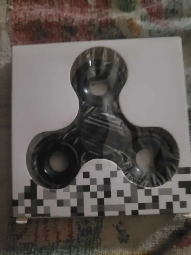 fidget spinner with black and white stripes
