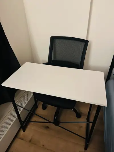 White computer desk with black metal frame. Small, sturdy, X-shaped design. Includes black mesh offi...