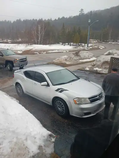 I'm selling my 2012 Dodge Avenger, a reliable sedan with a sleek silver finish, perfect for daily co...