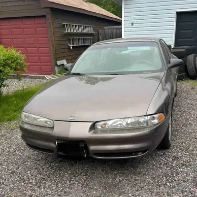 Getting rid of my old car. Not safe for the road anymore, lots of good parts, motor and trans in goo...