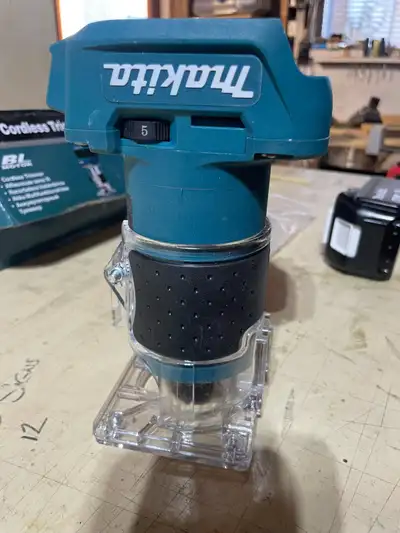 Makita router and battery , View more