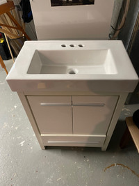 Bathroom sink and cabinet.