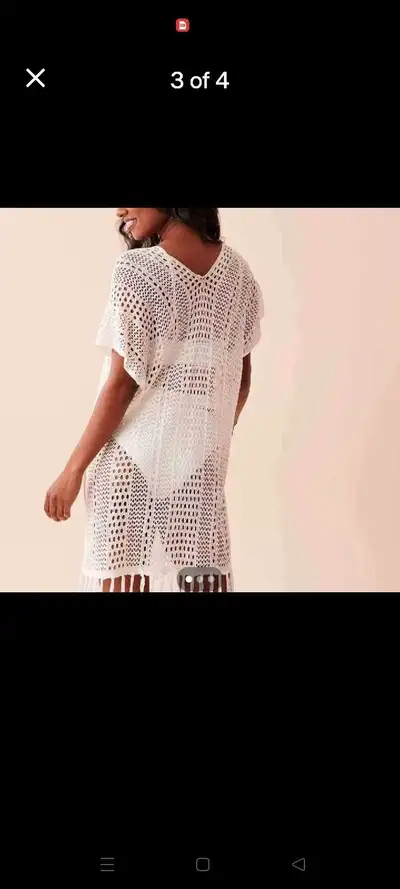 This beautiful white crochet kaftan by La Vie en Rose is perfect for a relaxed boho-chic look. It fe...