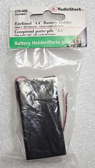 RADIO SHACK ENCLOSED "AA" BATTERY HOLDER w/LEADS 270-408 ITEM IS IN MINT CONDITION ASKING $4, OBO LO...