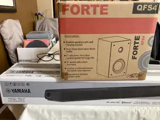 Wired surround sound speaker and two bookshelf speakers with wall hanging brackets perfect for your...
