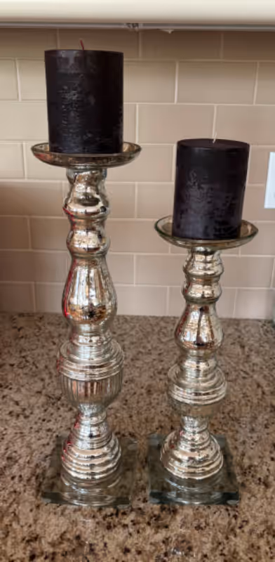 Two mercury glass decorative candle holders in like new condition. Tall holder is about 17” tall and...