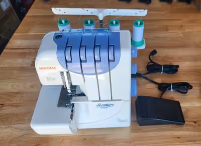 Janome Harmony Serger 9102D 4 spools setup. User-friendly In 2007, paid $400, brand new now $599.