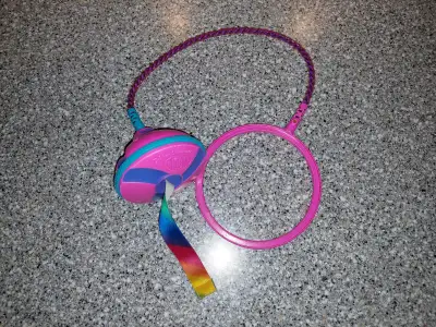 Here's a vintage Skip It Ribbon Streamer toy, it's made by Hasbro from 2003. It's still working fine...