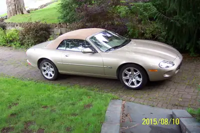 20th Anniversary James Bond movie, “Live Another Day” Gold Exterior, Tan Leather Interior, Burled Wa...
