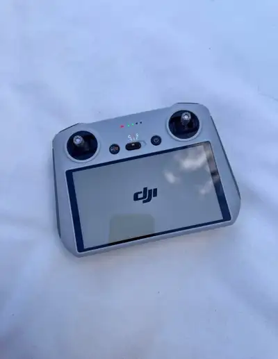 Elevate your aerial photography with this DJI RC remote controller, featuring a brilliant integrated...