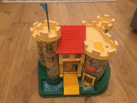 Vintage Fisher Price Castle with figures and furniture.