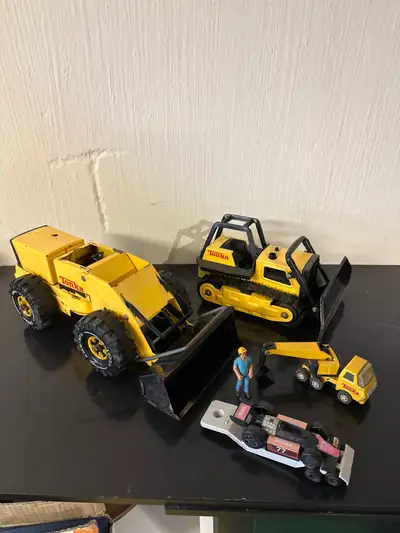 Collection of vintage Tonka toys. Well loved.