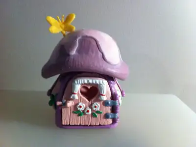 Made in West Germany in 1978 by Schleich. It is a very old small house (or cottage) and has pink and...